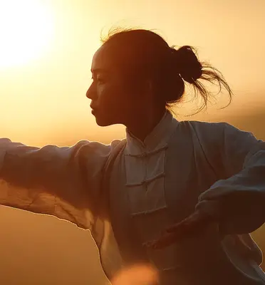 Energized person practicing Tai Chi to cultivate life energy and vitality